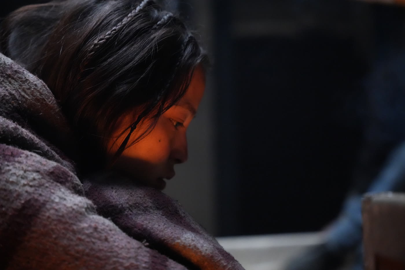 Still from Himalayan Gold: Sonam by the fire